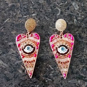 Pink beaded evil eye earrings
